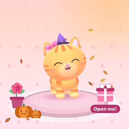 Halloween: the cat wears a tiny purple witch hat, with pumpkins by her flower pot.